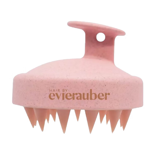 Pink scalp brush with 'Hair by evierauber' branding on a white background